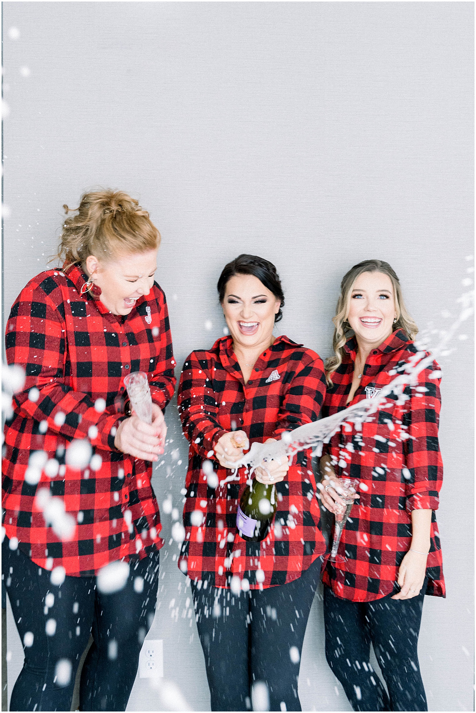 popping champagne at colorado winter wedding